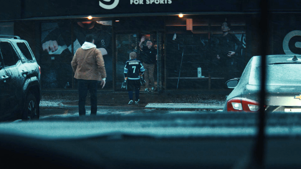 Source for Sports Dad and Son Entering Store
